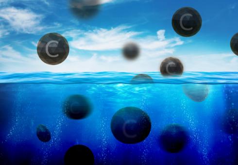 Black spheres with the letter "C" on them float out of the water